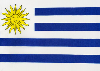 Fototapeta premium fabric-based national flag of Uruguay close-up