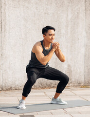 Handsome sportive man doing workout outdoor