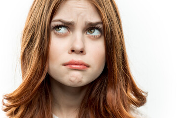 Naklejka premium pretty surprised woman red hair face closeup emotions