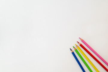 colored pencils on a white background copy the space. pencils for drawing on a blank white canvas