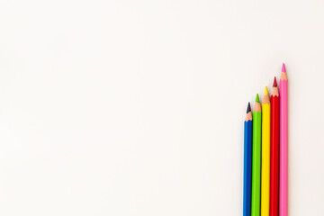 colored pencils on a white background copy the space. pencils for drawing on a blank white canvas