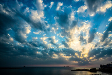 Naklejka na ściany i meble beautiful sunset with cloud sky at the coast of Batroun in Lebanon