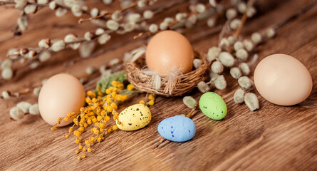 Naklejka na ściany i meble Christian holiday. A painted quail egg lies in the nest. 