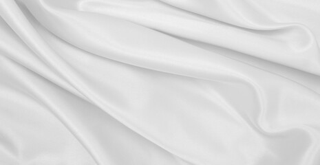 Smooth elegant white silk or satin luxury cloth texture as wedding background. Luxurious background design