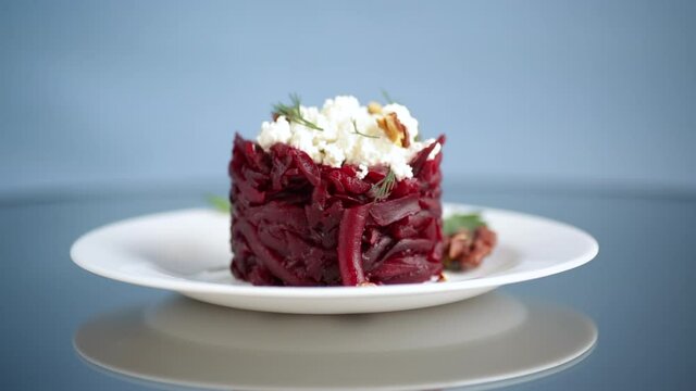 dietary salad of boiled beets with walnuts and cottage cheese