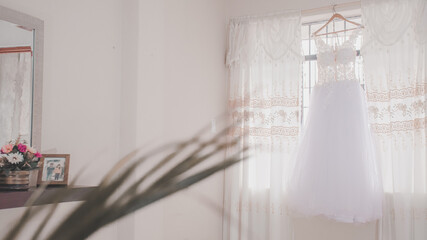 Fototapeta na wymiar Wedding dress hanging, marriage concept