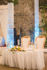 Wedding table decoration with flowers and snacks