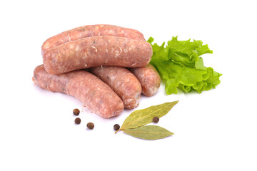 Raw pork sausages. Grilled sausages, spices close-up, isolated on a white background.Selective focus.