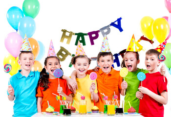 Group of happy kids with colorful candies.