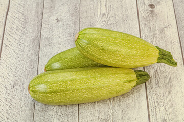 Young tasty zucchini over board