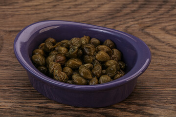 Tasty capers in the bowl