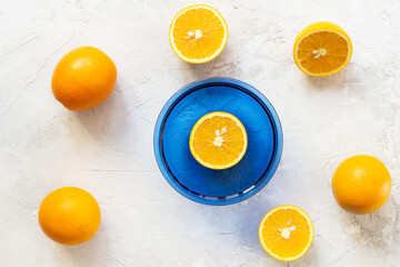 Fresh oranges on a gray background. Horizontal orientation, top view.