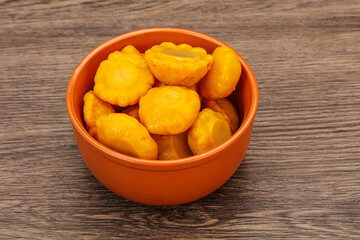 Marinated yellow patisson in the bowl