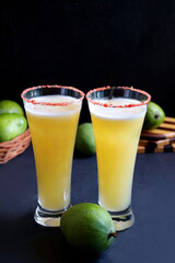 Indian traditional sweet green mango juice. Also known as Aam Panna, Ambyache Panha. Summer Refreshing drink made with raw mangos, jaggery, and salt. Recipe ingredients with copy space.