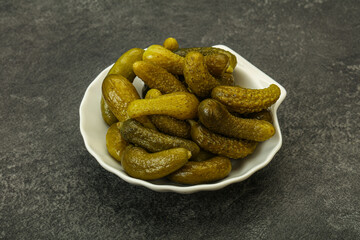 Pickled gherkin in the bowl