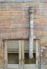 Old abandoned house window and chimney pipe, Tehran, Iran