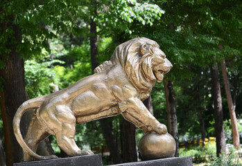 Old lion statue in City Park, Tehran, Iran