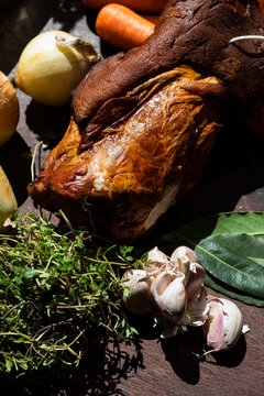 Still life fresh roasted suckling pig and ingredients
