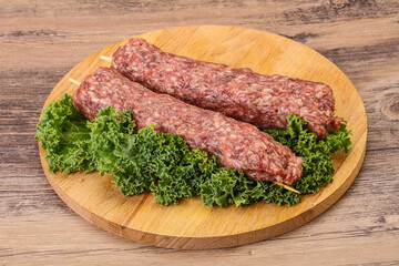 Raw minced beef kebab skewer