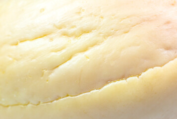 Natural wooden texture of bone avocado. Beige eco background. Close up.