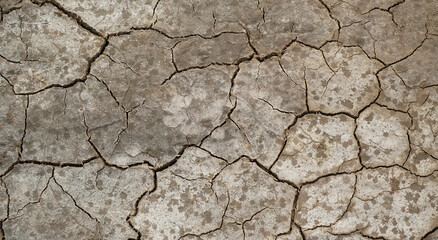 Cracked soil ground into the dry season, Broken clay pattern, Texture background