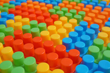 Plastic building blocks pattern background, Colored toy bricks for kid, Close up