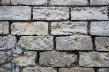texture old wall with white brick masonry made of calcareous stone