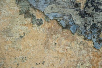 Background from an old wall with layers of peeled paint, copy space, space for text