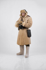 A man in a winter military uniform of an officer of the Soviet army during World War Two