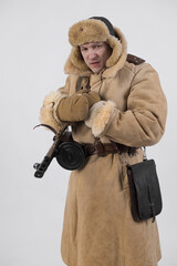 A man in a winter military uniform of an officer of the Soviet army during World War Two