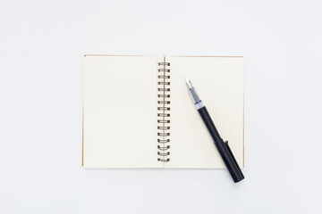 Pen on Notebook isolated on white background