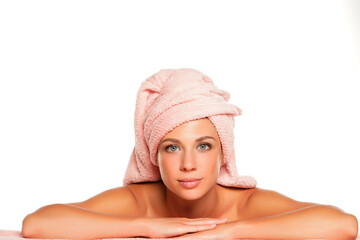 Young smiling beautiful woman posing with towel on her head