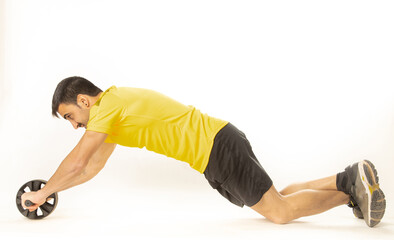 Obraz premium man with Ab roll Bodytone for abdominal strengthening. Small wheel that allows exercises to strengthen the core. on white background..