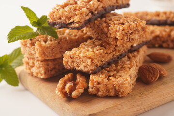 Various healthy granola bars (muesli or cereal bars). Set of energy, sport, breakfast and protein bars. Puffed rice, berries, chocolate, oatmeal, almond and honey cereal bars.