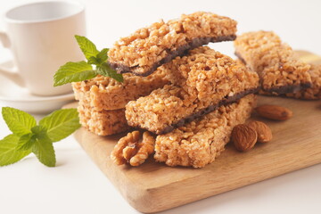 Various healthy granola bars (muesli or cereal bars). Set of energy, sport, breakfast and protein bars. Puffed rice, berries, chocolate, oatmeal, almond and honey cereal bars.