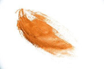 Orange acrylic brushstroke isolated on a white background.