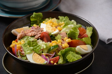 Tuna Fish Salad with Lettuce, Cherry Tomatoes, Cucumber, boiled eggs, onions and Corn