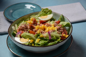Tuna Fish Salad with Lettuce, Cherry Tomatoes, Cucumber, boiled eggs, onions and Corn