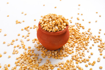 Dried chickpeas pulses in bowl isolated on white background.