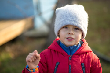 Handsome young boy, outdoor spring or autumn portrait