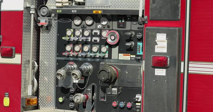 Fire engine pump gauges and levers on a Gatineau fire truck in Quebec, Canada.