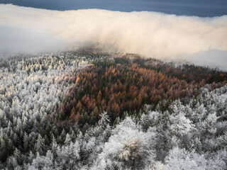 Magnificent view from Watchtower in the mountains during the winter. Land covered by snow, peace in soul during amazing sunset.