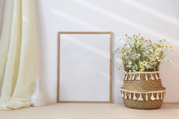 Wooden frame mockup with basket of spring flowers