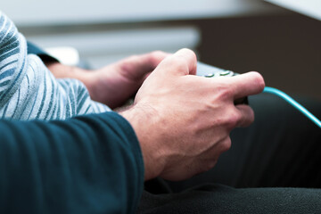 detail of hands playing video games