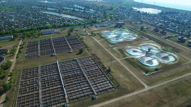 Drone aerial view on water treatment plant with motion graphics.