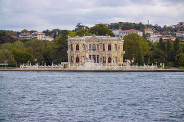 Fototapeta na wymiar View from the water of the Bosphorus Strait on the facades of historical buildings in the city of Istanbul. On the streets of the city in public places.