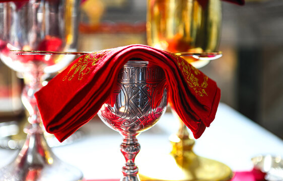 Orthodox faith. Gold and silver bowls for communion on the throne of the Orthodox Church. The concept of Orthodoxy. - Powered by Adobe