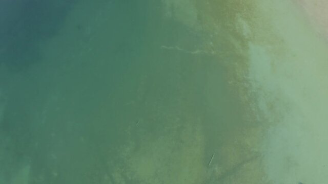 Ariel over Achen Lake, Austria with the sun reflecting off the water