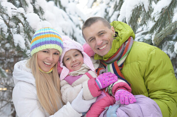 happy  family at beautiful sunny winter day outdoor in nature