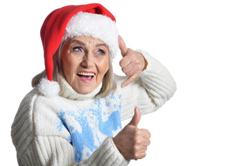 Portrait of smiling happy senior woman in Santa hat